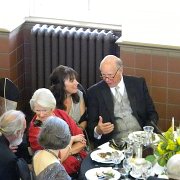 "So hears the plan..." Gary is distracting Senator Roberts' wife while Deb fills him in on all the new changes to make. :-)