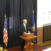Senator Pat Roberts addressing the crowd which filled the main floor to capacity ...