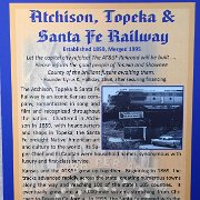 The poster for the induction of The Atchison, Topeka and Santa Fe Railway on display in the Mezzanine at the Great Overland Station Museum.