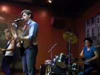 (l. to. r.) Josh Hartranft on bass and vocals; Chris Aytes on guitar and vocals; Renelle Aytes on drums